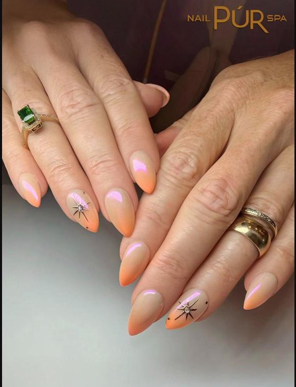 Peach ombré almond nails with chrome and star charms