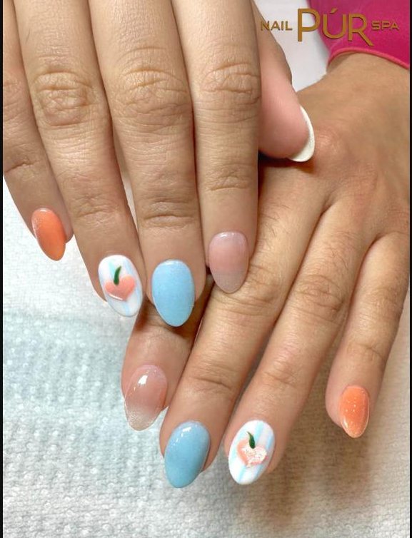 Pastel blue and peach nails with a tiny peach design